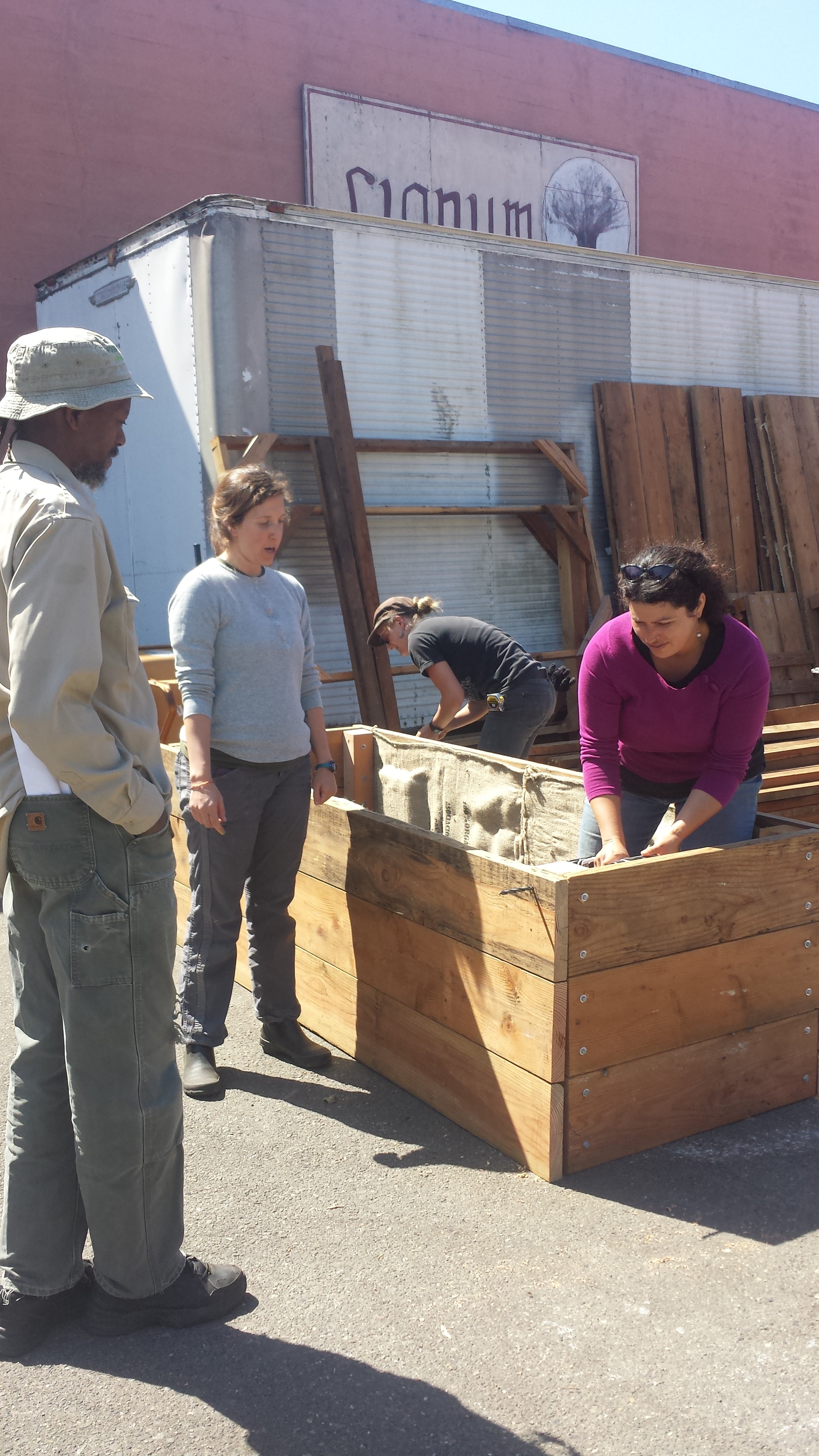 Garden Program Manager Alison Fischman leads staff in a training on the new box design