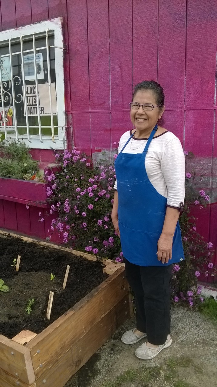 Rosa in front of her new garden Rosa in front of her new garden